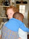 Anna at Nyumbani in 2001, with friend