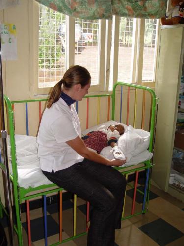 Latia, 2004, with volunteer nurse Latia, 2004, with volunteer nurse