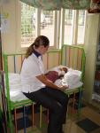 Latia, 2004, with volunteer nurse
