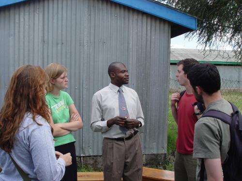 Talking with Newton Oyugi at his clinic in Mukuru