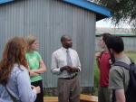 Talking with Newton Oyugi at his clinic in Mukuru