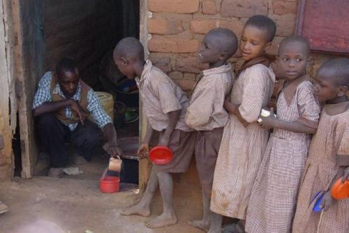 Serving porridge at the school
